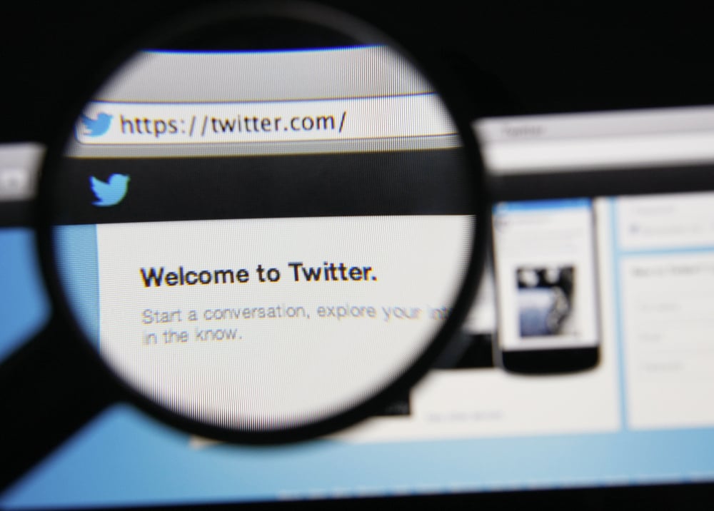 A magnifying glass over the Twitter home page