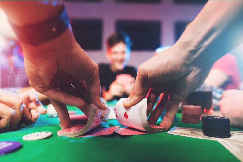 First-person view of poker player shuffling deck