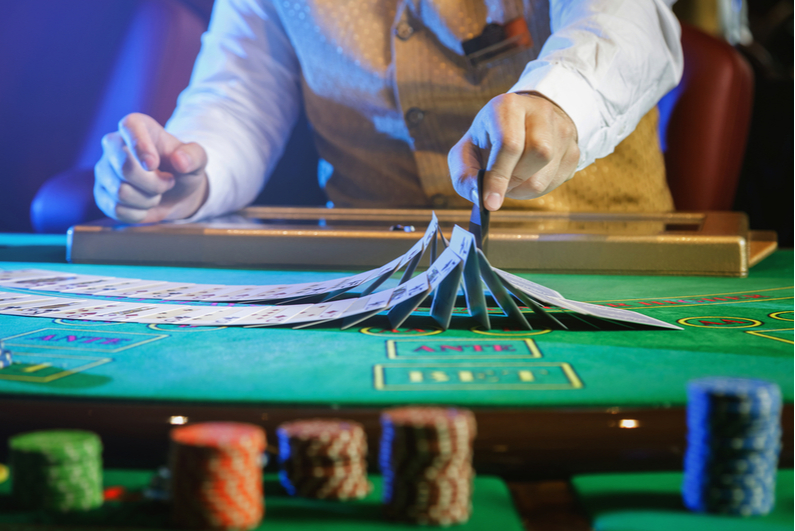 casino dealer shuffling cards