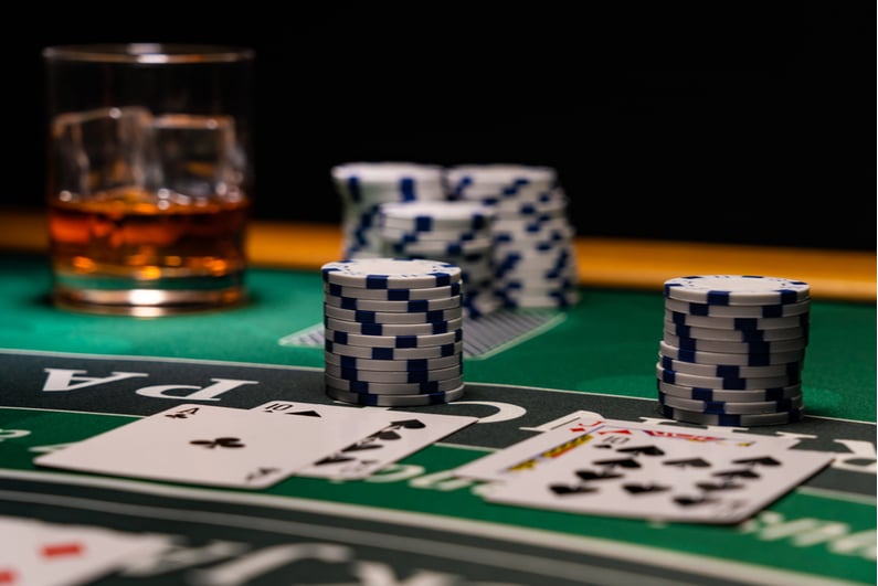 Closeup view of cards and chips on a blackjack table