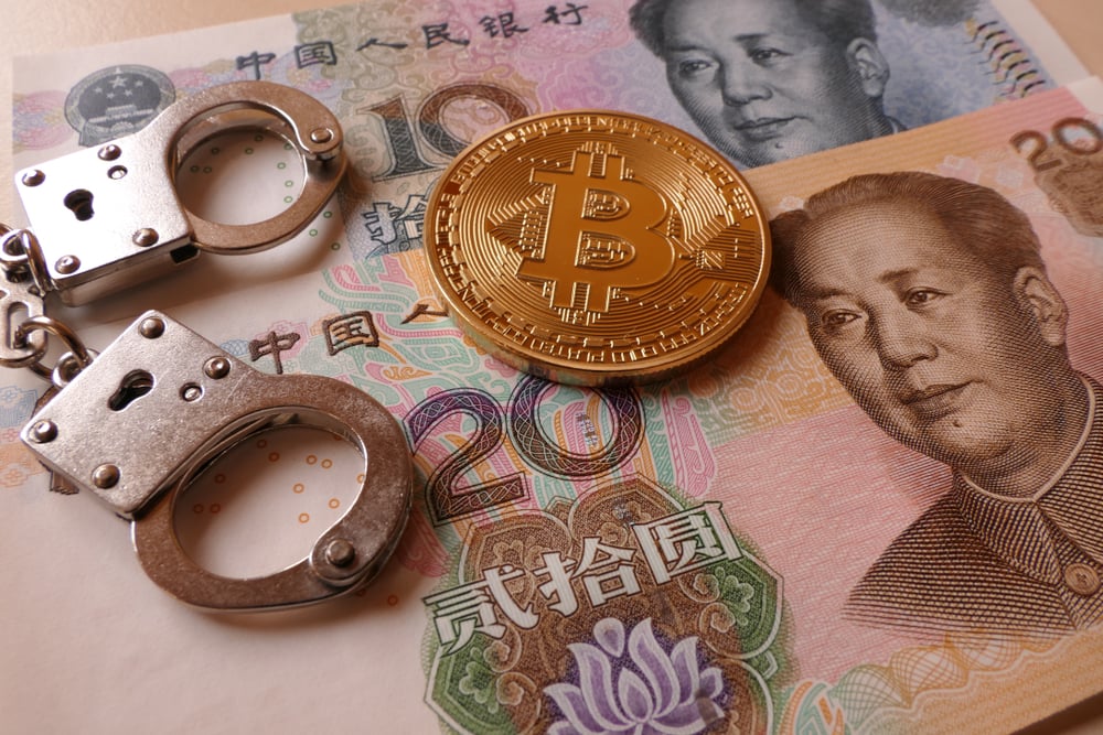 Chinese Yuan, bitcoin and handcuffs