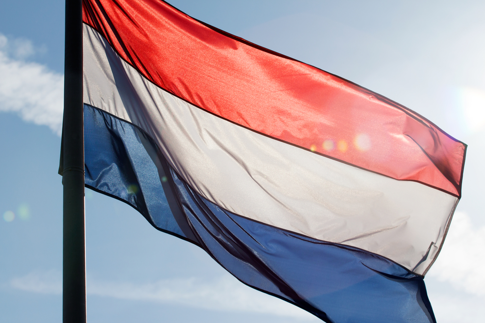 Dutch flag on a mast in the sunlight