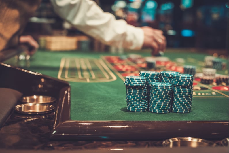 Closeup of chips on a casino gaming table