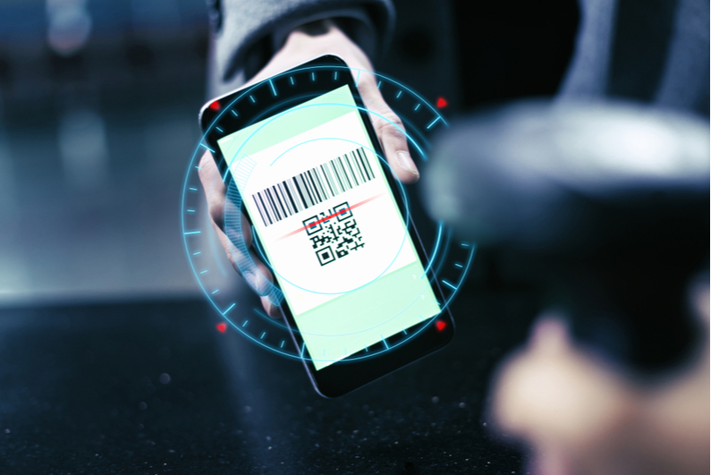 Person holding a smartphone to scan a QR code