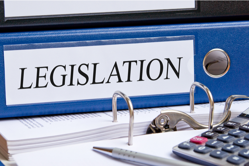 Blue binder with "LEGISLATION" written on the spine