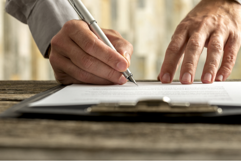 Man signing a contract