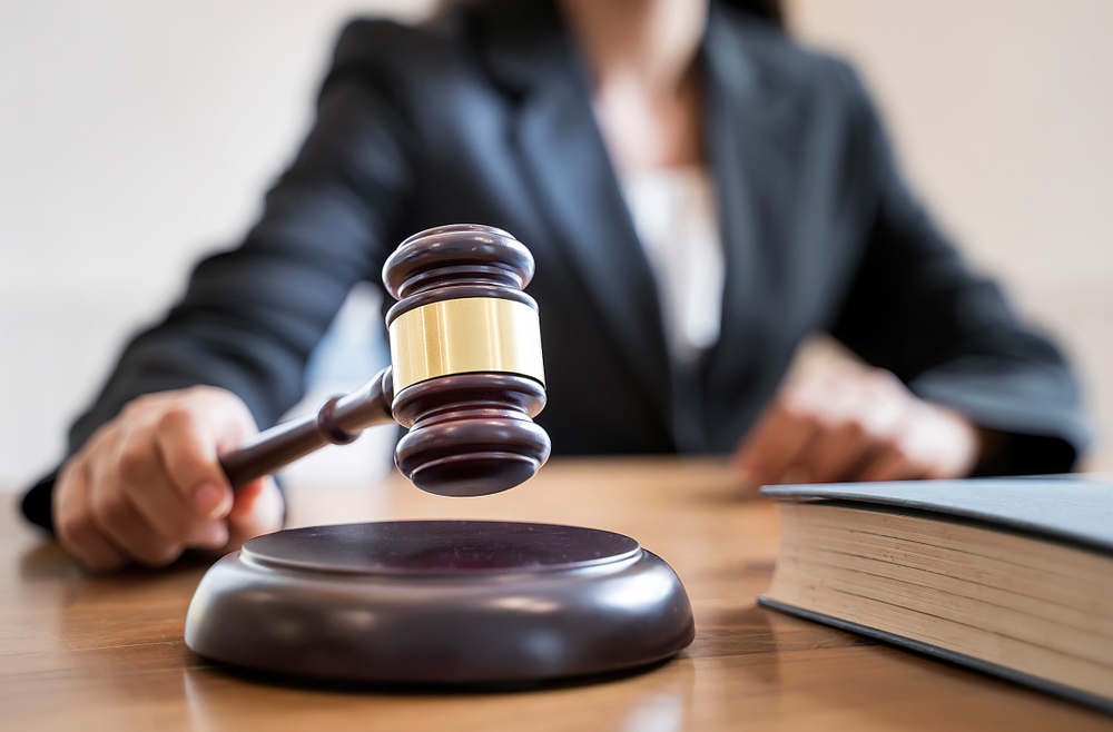 female judge holding gavel