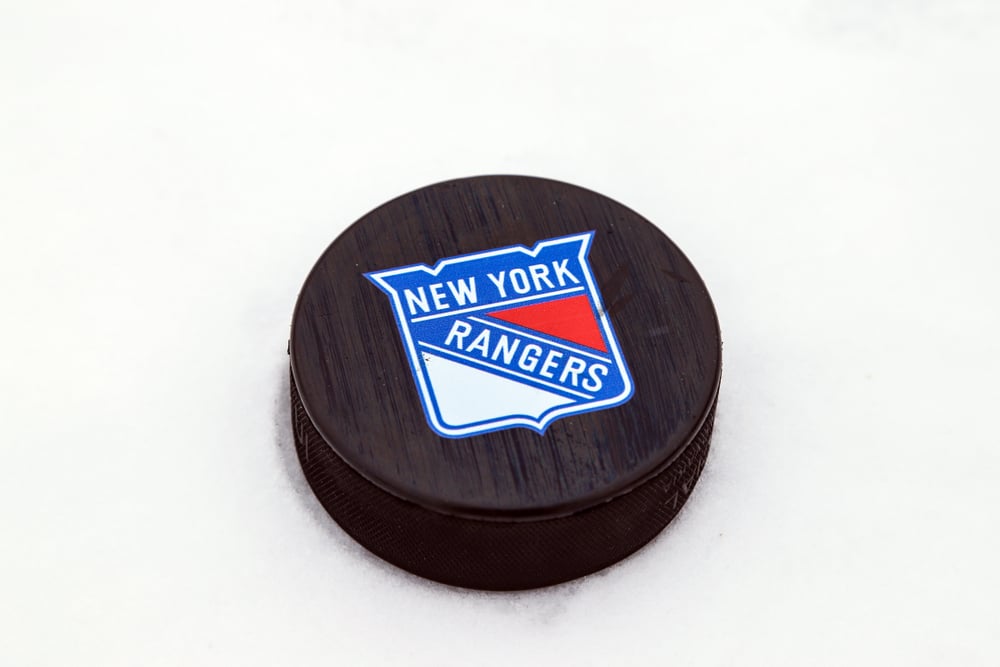 ice hockey puck with New York Rangers logo