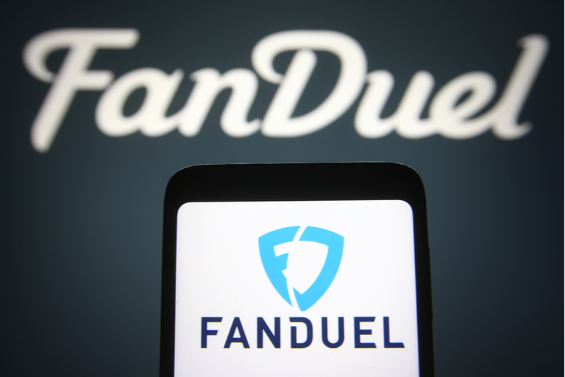 FanDuel logo on a smartphone and in the background