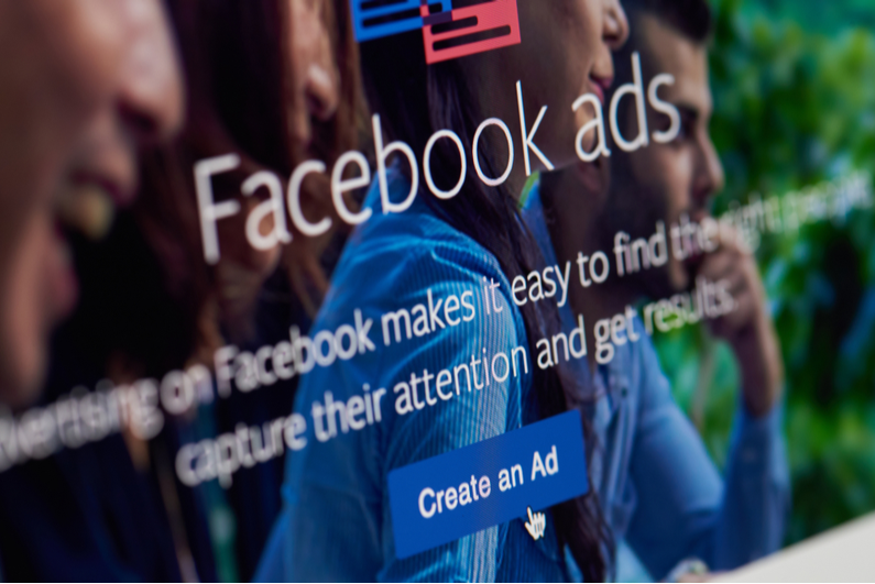 Closeup of monitor showing the intro to the Facebook ad creator app