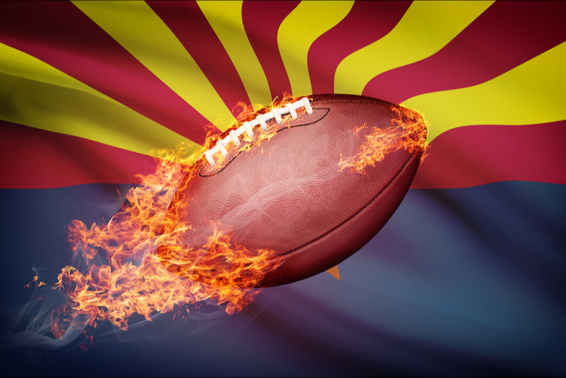 Football on fire in front of Arizona flag