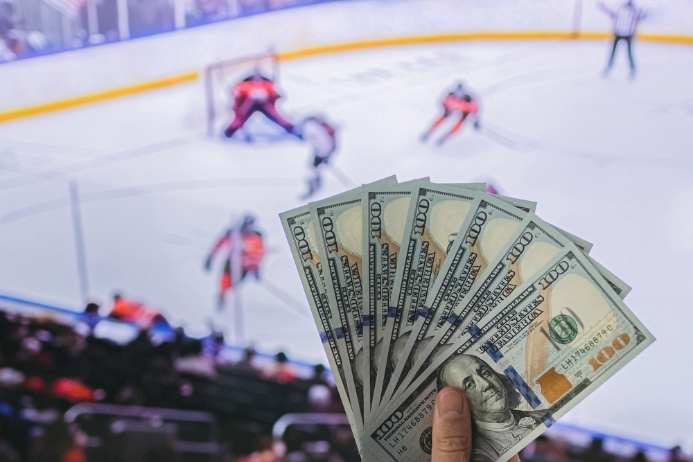 Dollars in front of hockey game