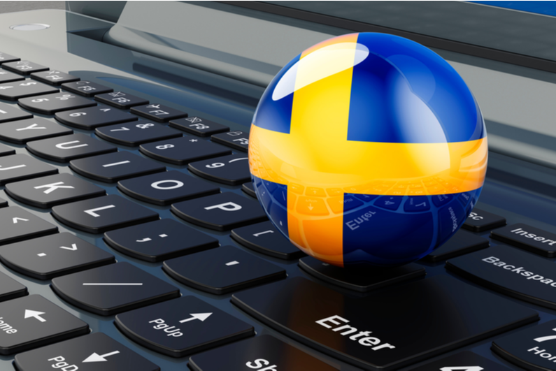 Swedish flag ball on a keyboard
