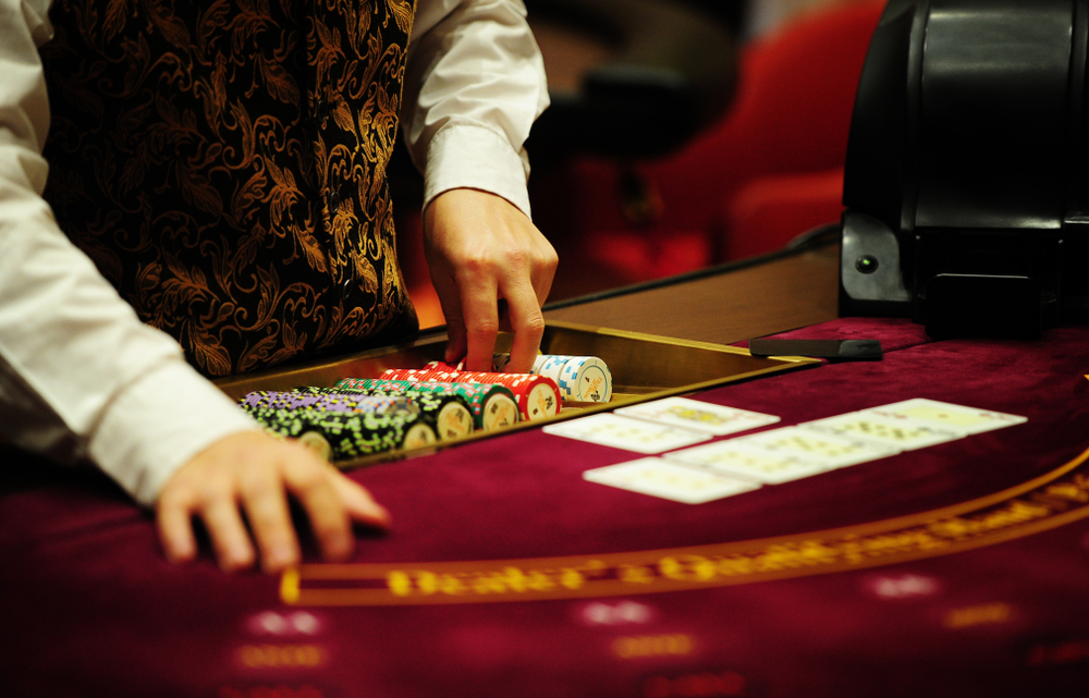 Casino worker with chips