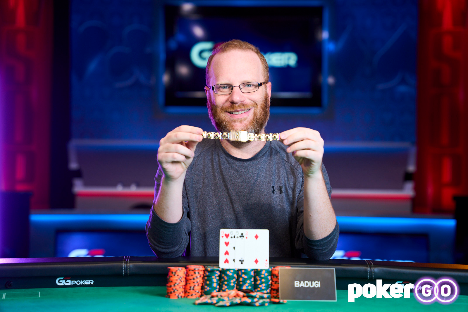 Adam Friedman holding up WSOP bracelet won