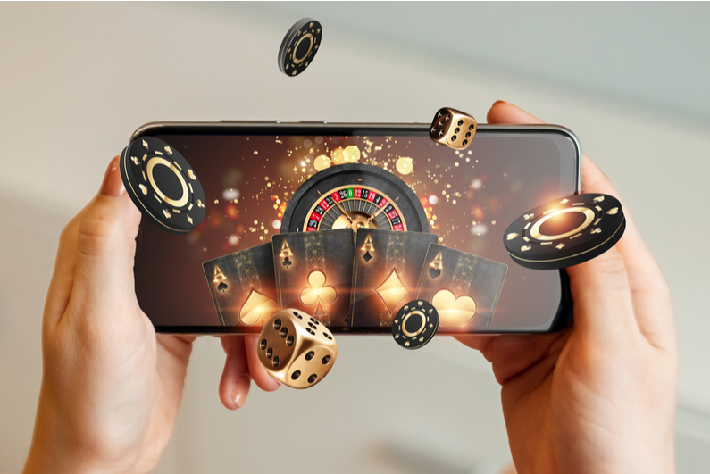 Smartphone with casino items flying out of it