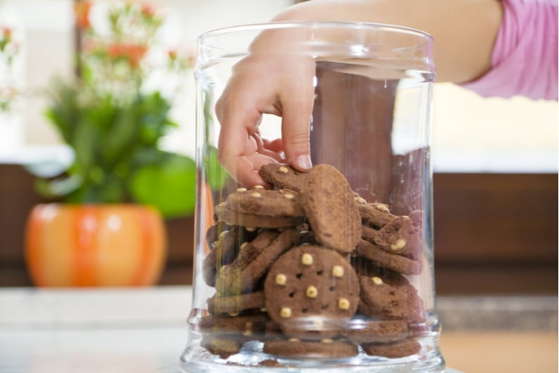 Hand stealing from a cookie jar