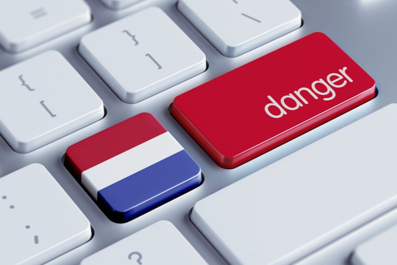 Laptop keyboard with Netherlands flag and "danger" keys