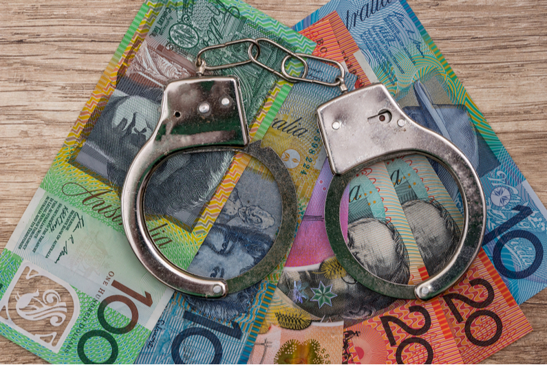 Handcuffs on Australian dollars