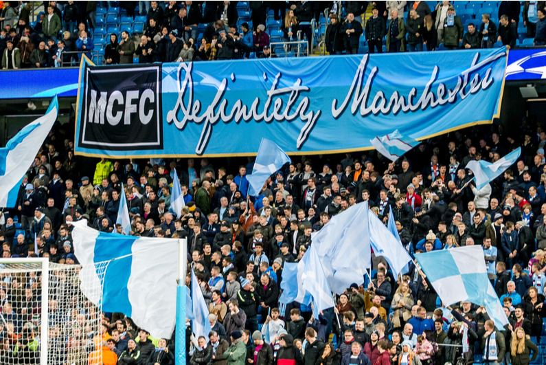 Manchester City fans at a soccer match