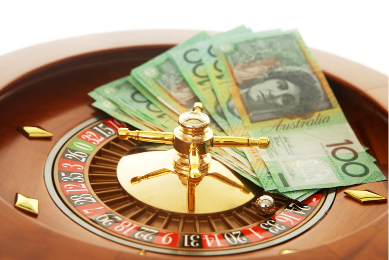 Australian cash on roulette wheel