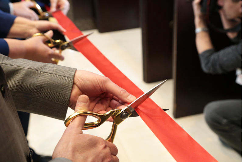 Cutting a red ribbon