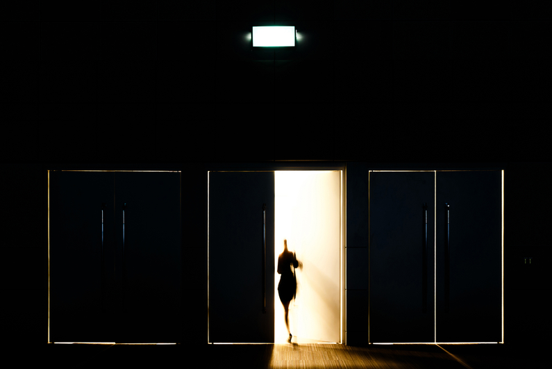 Blurred woman leaving building