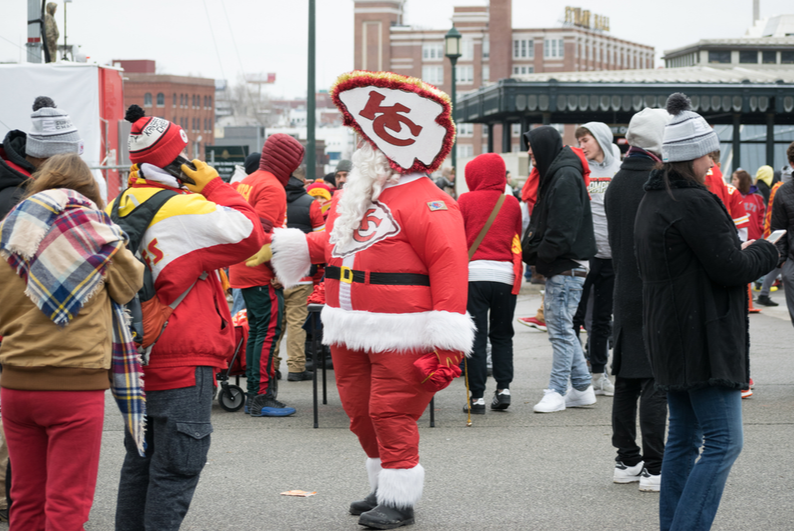 A Kansas City Chiefs fan in a Santa suit