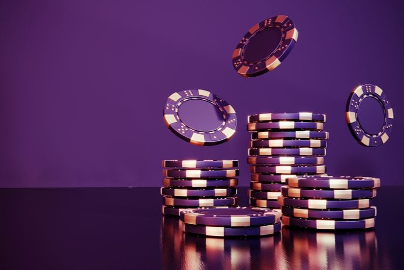 purple poker chips on a purple background