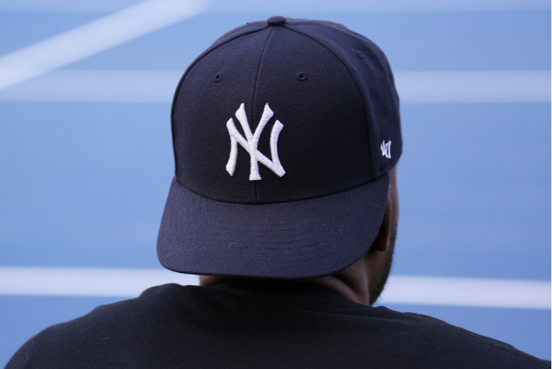 man wearing a yankees hat