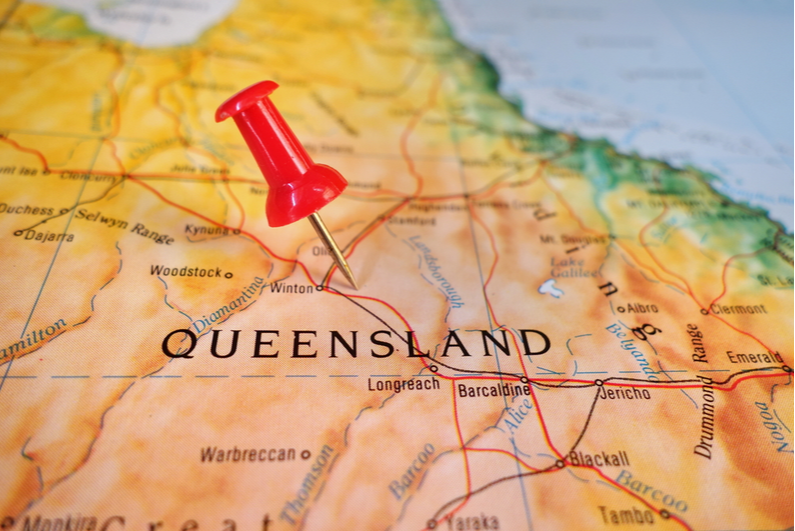 Pushpin on Queensland on a map
