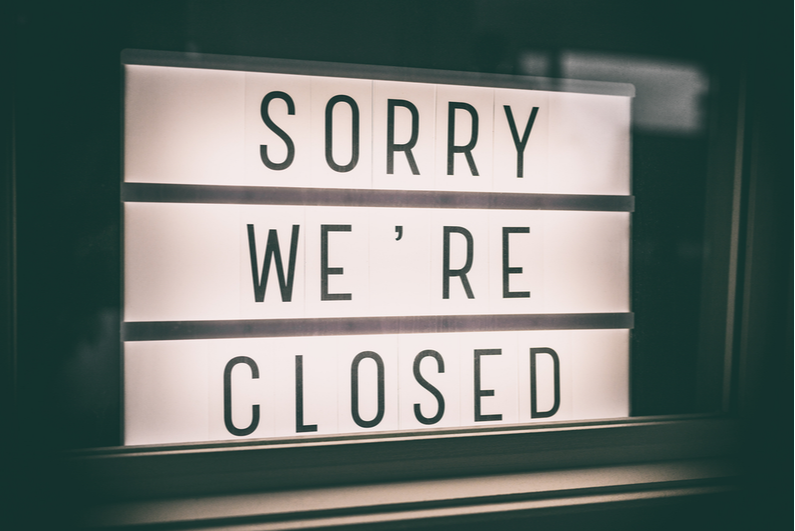 Sorry We're Closed storefront window sign