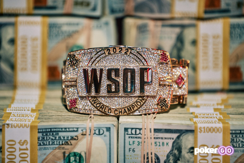 2022 WSOP Main Event bracelet on top of cash