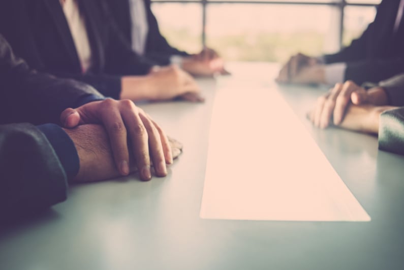 People sitting round business table