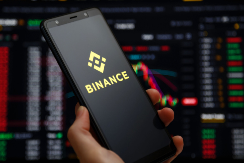 Binance logo on phone