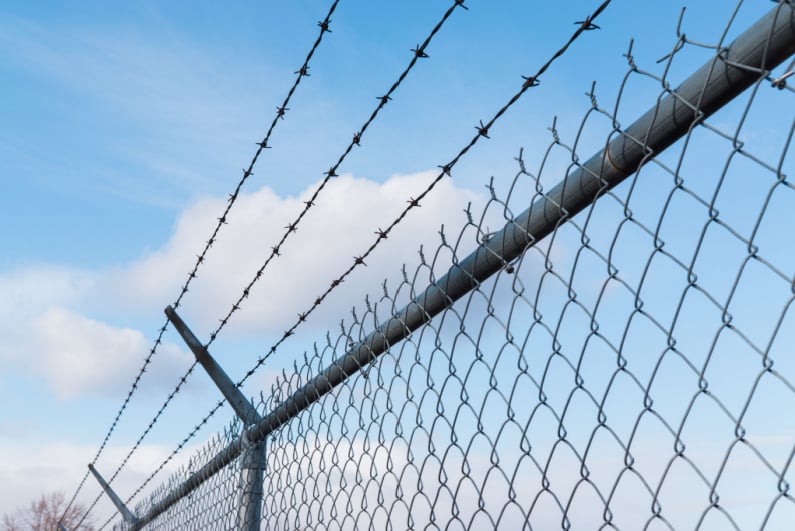 Barbed wire over a prison