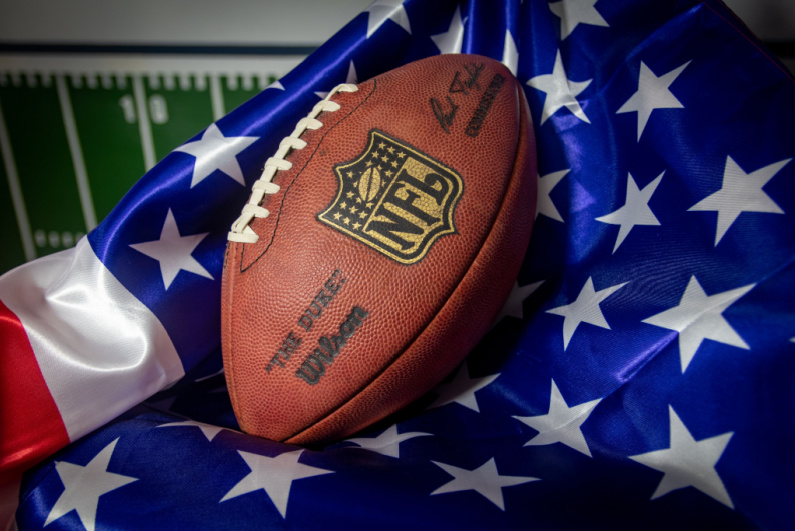 NFL football on a USA flag