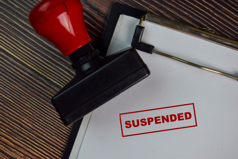 "suspended" rubber stamp
