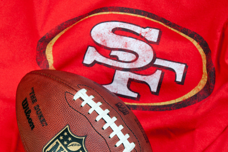 49ers logo and football