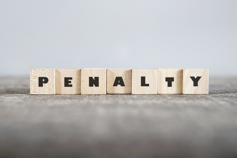 "PENALTY" spelled out in wooden blocks