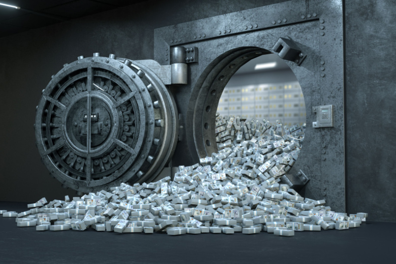 Cash spilling out of a vault