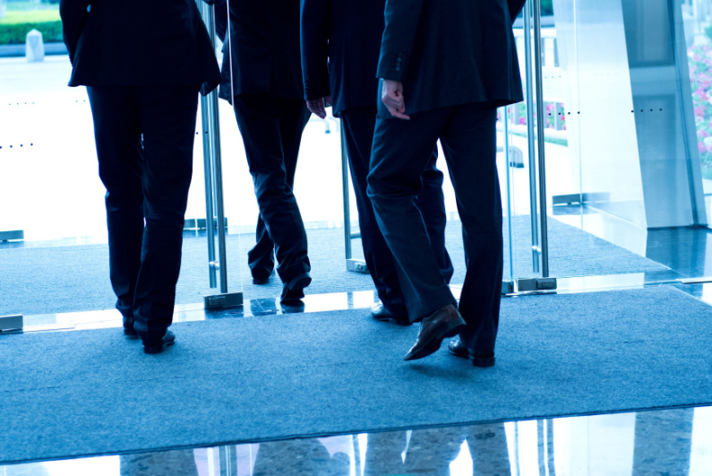 Businesspeople exiting a building