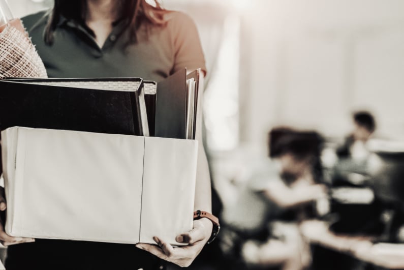 Woman carrying her office belongings