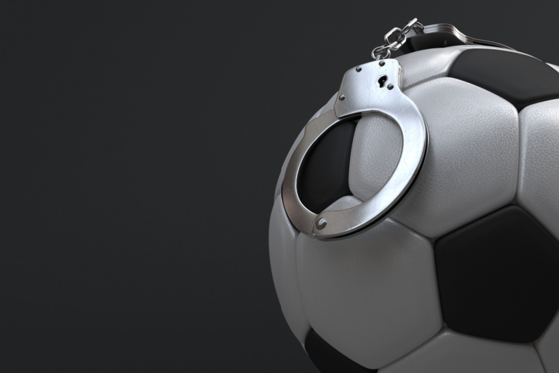 Soccer ball with handcuffs
