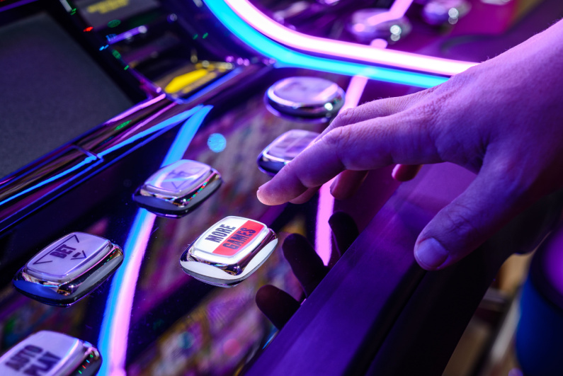 A person playing a slot machine