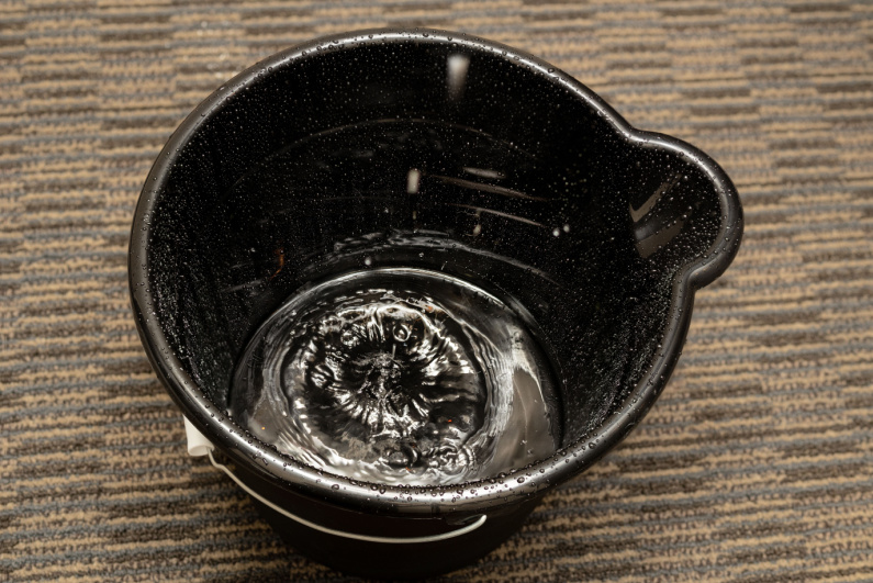 Water drops in a bucket