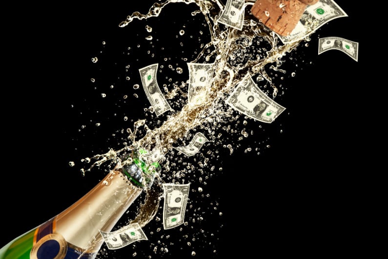 Champagne bottle popping out cash