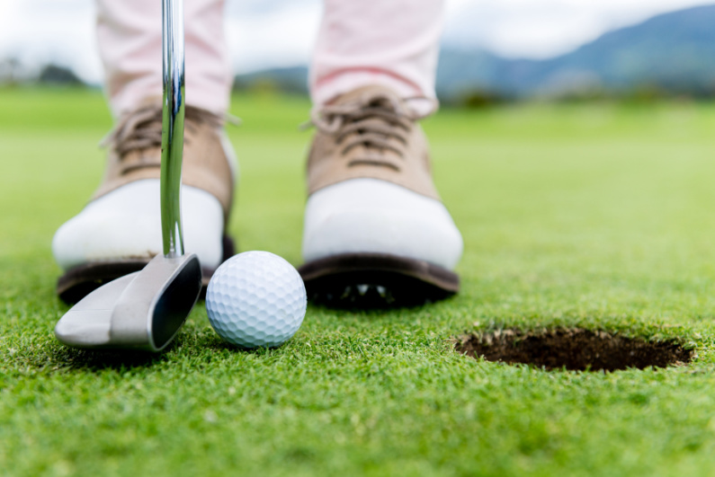 Golfer making a putt