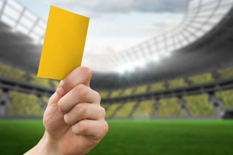 Yellow card being held