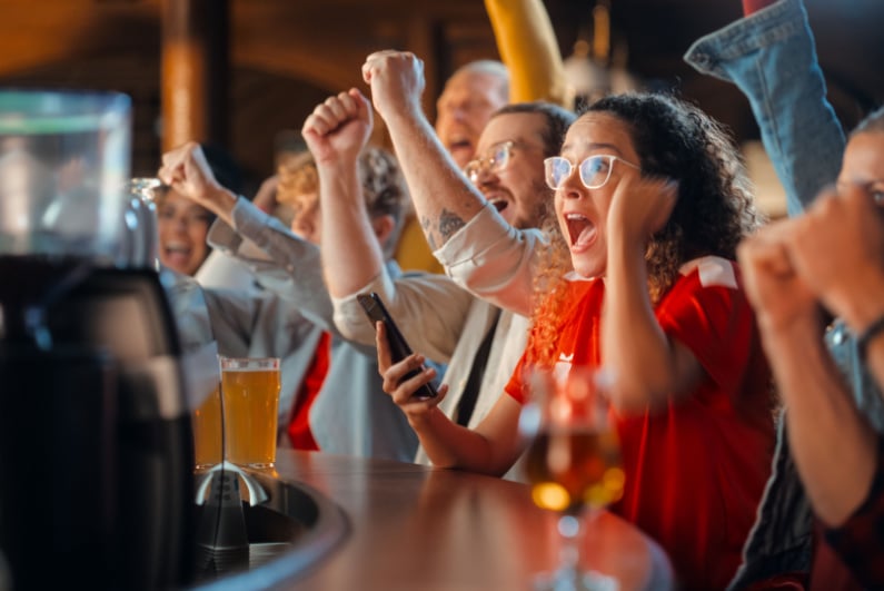 People excited about a game at a sports bar